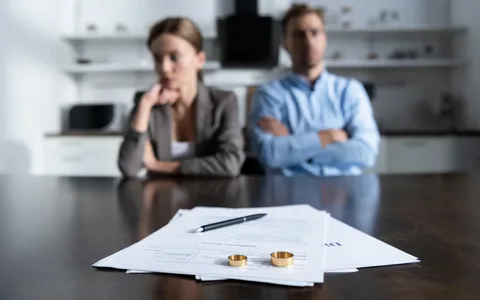 Divorced couple sitting separately during a legal consultation