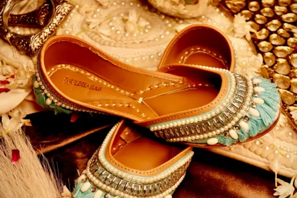 Elegant bridal jutti featuring pearl work, embroidery, and traditional craftsmanship for wedding celebrations