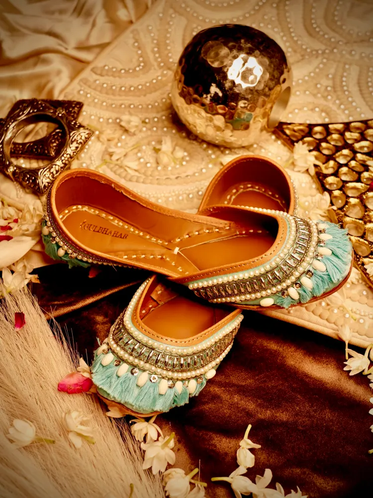 Elegant bridal jutti featuring pearl work, embroidery, and traditional craftsmanship for wedding celebrations