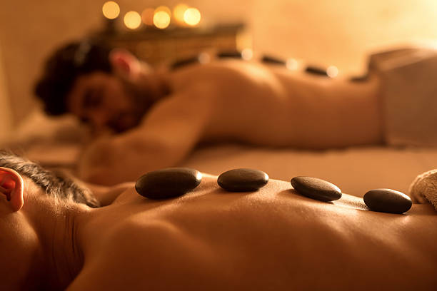 Professional hot stone massage therapy for relaxation and whole-body wellness