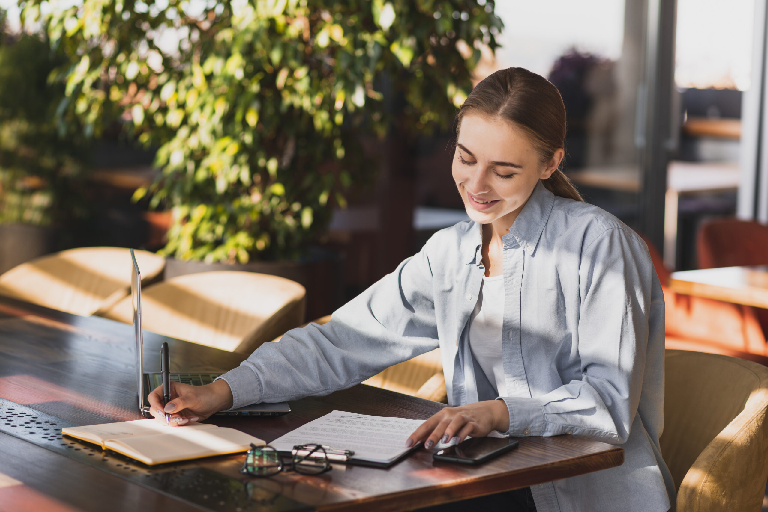 young-woman-writing-clipboard